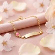 Златна детска гривна с плочка