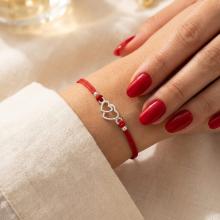 Гривна с червен конец и сребърен елемент две сърца