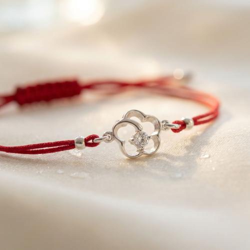 Гривна с червен конец и сребърен елемент цвете с циркон 