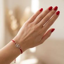 Гривна с червен конец и сребърен елемент цвете с циркон