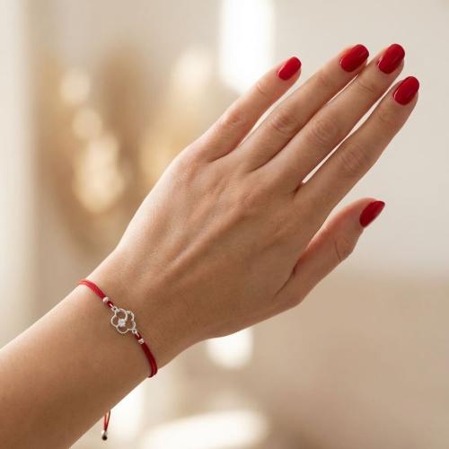 Гривна с червен конец и сребърен елемент цвете с циркон 