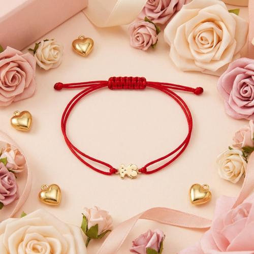 Гривна с червен конец и 14 карата златен елемент мече