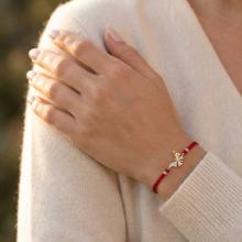 Гривна с червен конец и златен елемент пеперуда с циркони B60