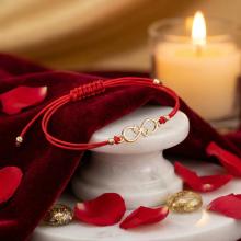 Гривна с червен конец и 14 карата златен елемент безкрайност