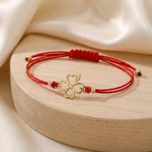 Гривна с червен конец и 14 карата златен елемент детелинка с циркон