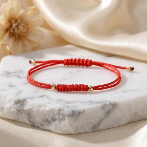 Гривна с червен конец и 14 карата златни топчета