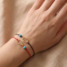 Гривна с черен конец и златен елемент Ръката На Фатима