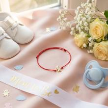 Гривна с червен конец и 14 карата златен елемент момче