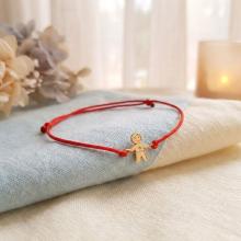 Гривна с червен конец и 14 карата златен елемент момче