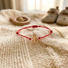 Гривна с червен конец и 14 карата златен елемент момче