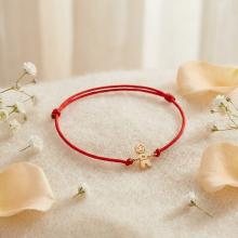 Гривна с червен конец и 14 карата златен елемент момче