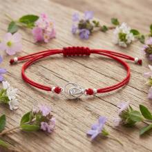 Гривна с червен конец и сребърен елемент Богородица В9