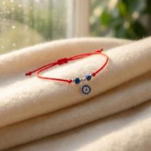 Гривна с червен конец с Dark Heliotrope и сребърен елемент синьо око