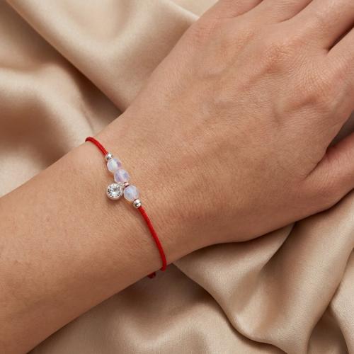 Гривна с червен конец и сребърен елемент циркон