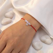 Гривна с червен конец и сребърен елемент циркон