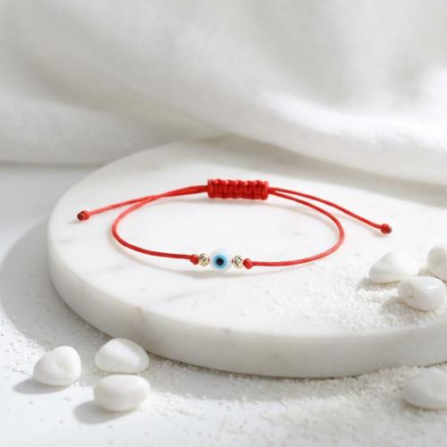 Гривна с червен конец златни топчета и синьо око