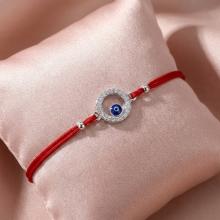 Гривна с червен конец и сребърен елемент синьо око BT17