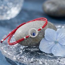 Гривна с червен конец и сребърен елемент синьо око BT17