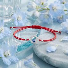 Гривна с червен конец и сребърен елемент синьо око BT17