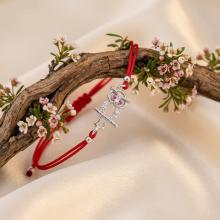 Гривна с червен конец и сребърен елемент сова