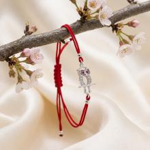 Гривна с червен конец и сребърен елемент сова