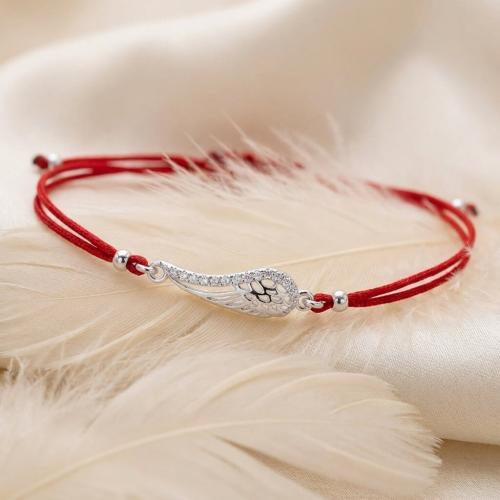 Гривна с червен конец и сребърен елемент ангелско крило BT28