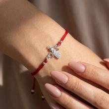 Гривна с червен конец и сребърен елемент ангелче с циркони