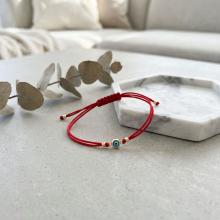 Гривна с червен конец и златен елемент синьо око BT41