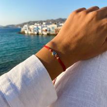 Гривна с червен конец и златен елемент синьо око BT41