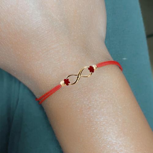 Гривна с червен конец и 14 карата златен елемент безкрайност