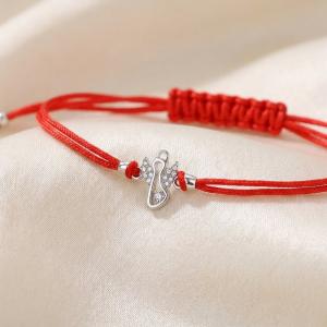 Гривна с червен конец и сребърен елемент ангелче с циркони