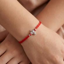 Гривна с червен конец и сребърен елемент ангелче с циркони