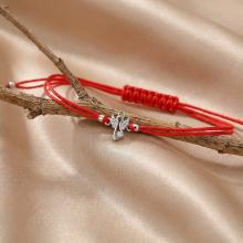 Гривна с червен конец и сребърен елемент ангелче с циркони