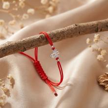 Гривна с червен конец и сребърен елемент ангелче с циркони